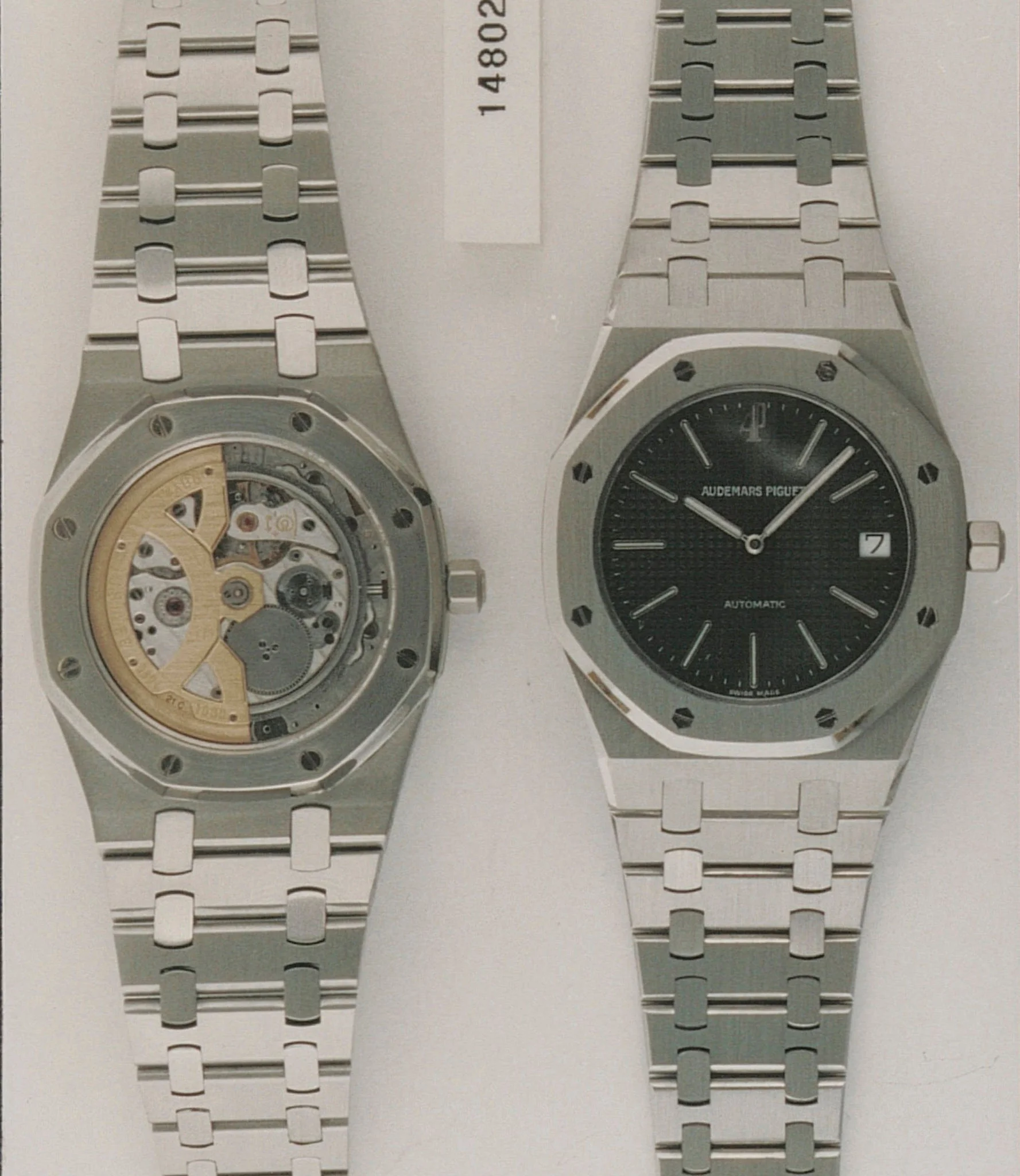 AP archive identification photograph of a 14802ST, front and back: steel case, dark-blue Tapisserie dial with AP at 12, sapphire caseback showing the gold anniversary rotor. · Photo: Audemars Piguet · Licence pending · Source: https://apchronicles.audemarspiguet.com/en/model/14802-royal-oak-jubilee