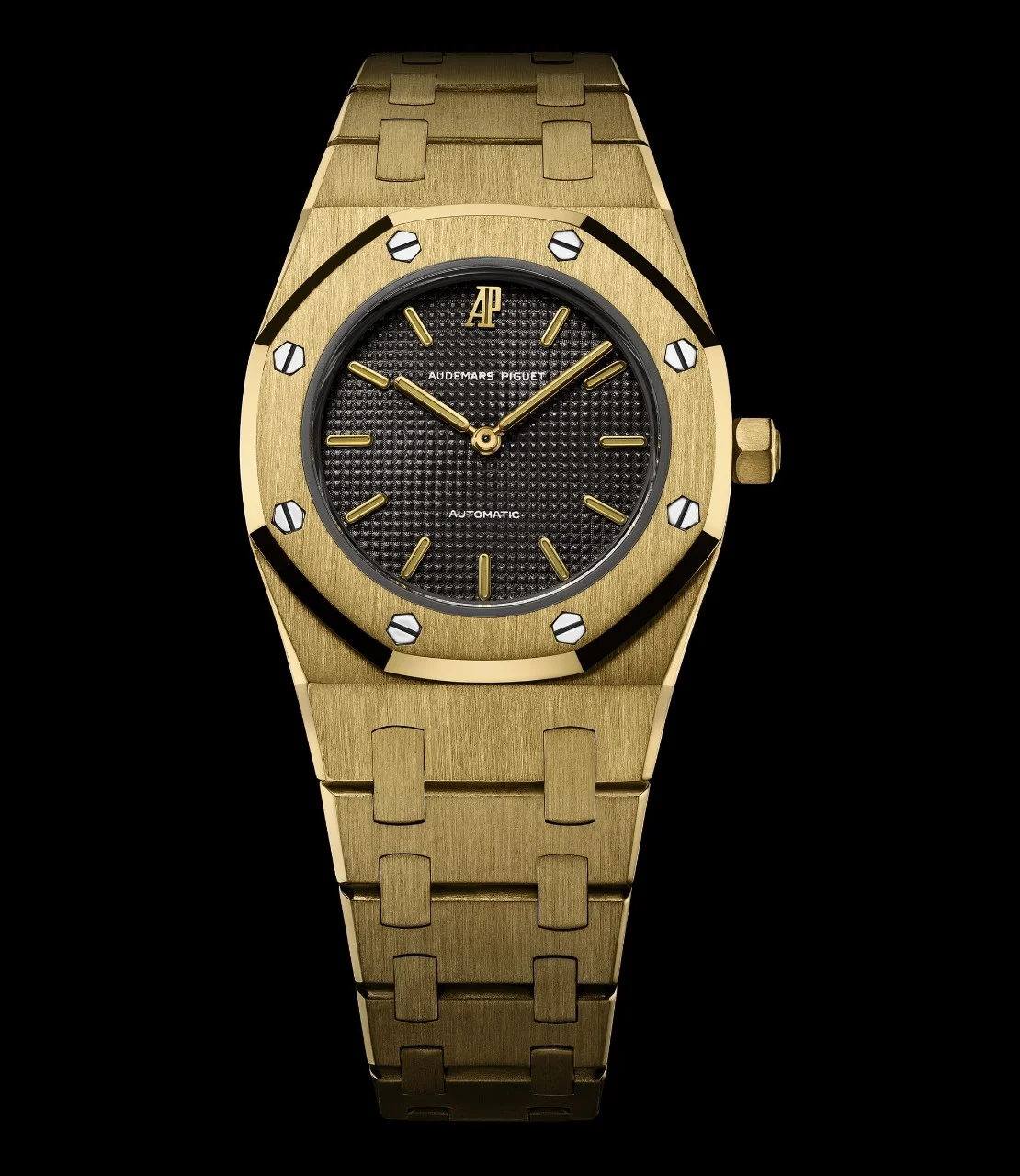 Yellow-gold 8638BA No. 1 (case B14001, sold 4 May 1977): gold case and bracelet, dark Tapisserie dial with gold markers and AP at 12. · Photo: Audemars Piguet · Licence pending · Source: https://apchronicles.audemarspiguet.com/en/model/8638