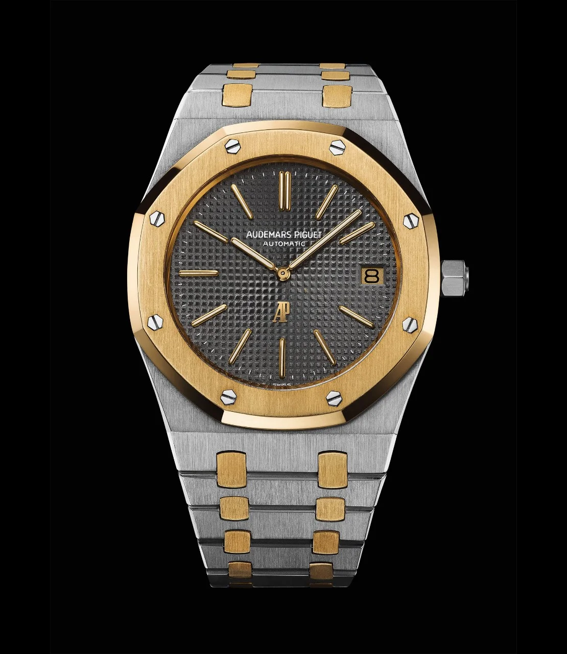 Two-tone 5402SA No. 286 (case B20804, sold Hong Kong 1978): steel case and links, yellow-gold bezel and studs, slate-grey Tapisserie dial with gold markers, AP at 6. · Photo: Audemars Piguet · Licence pending · Source: https://apchronicles.audemarspiguet.com/en/model/5402