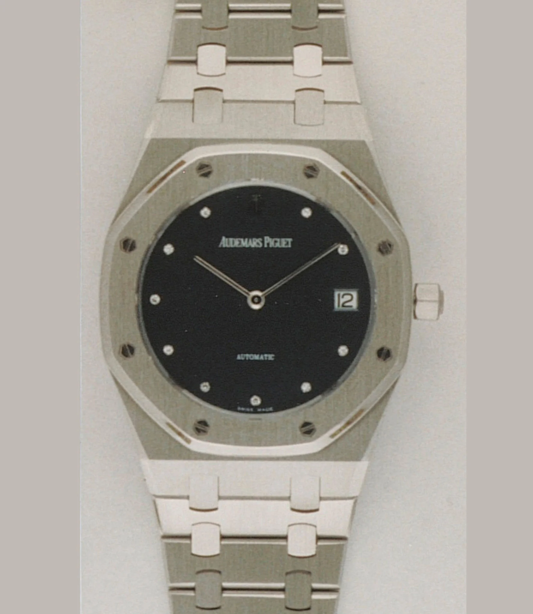 AP identification photograph of the platinum 14802PT: platinum case and bracelet with a plain dark-blue dial and diamond hour markers. · Photo: Audemars Piguet · Licence pending · Source: https://apchronicles.audemarspiguet.com/en/model/14802-royal-oak-jubilee